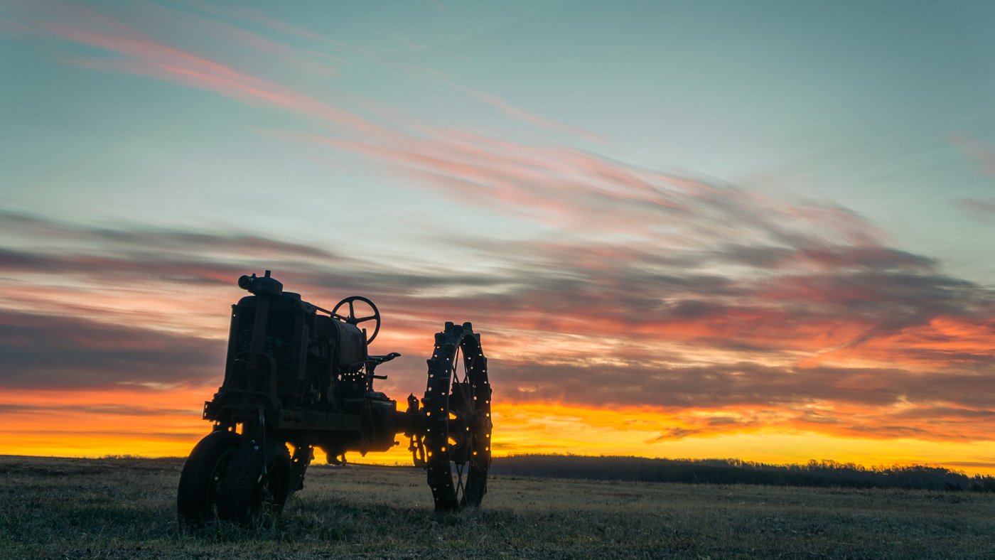 Tractor In the Field At Dawn